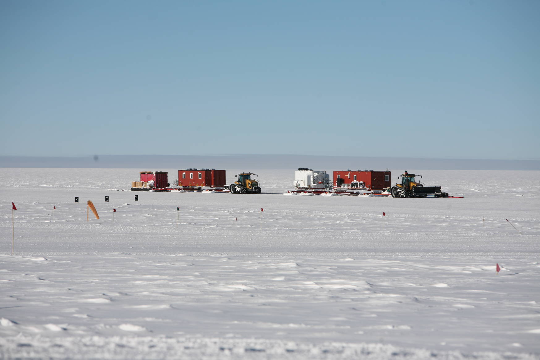 The first two tractors. From right to left: Common area (kitchen, bathroom, etc), generator container, bed rooms, storage.
