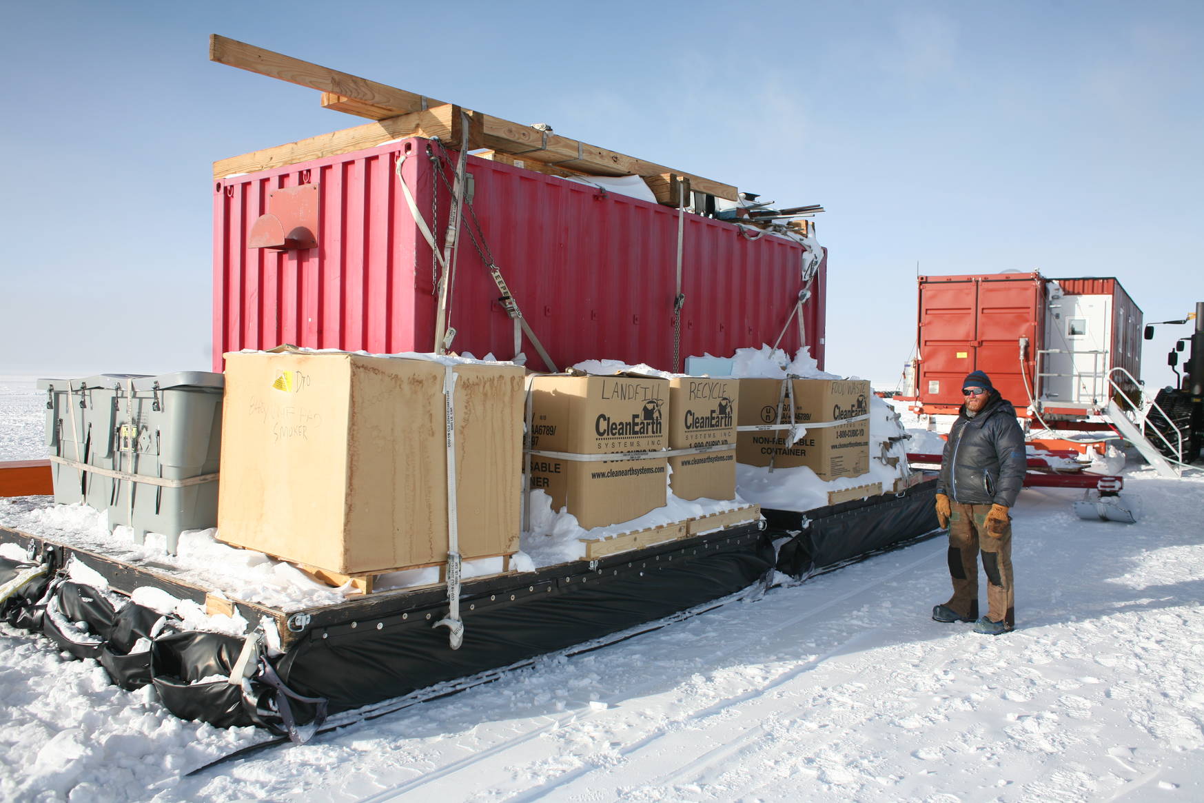 Two of the four containers: The closer one
is for storage of food, tools, trash, etc. The one further away contains five
bedrooms, each shared by two persons.