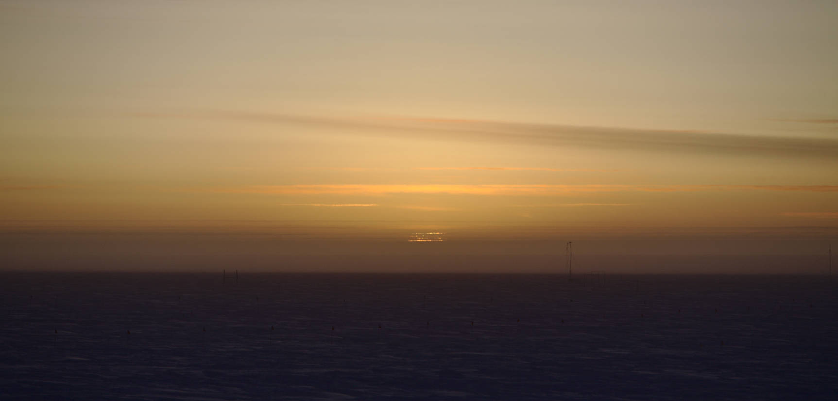 The top line occasionally gets a bright green tint. This atmospheric phenomena is called the green flash.